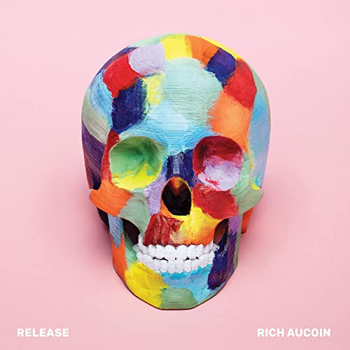 A multicolored painted skull on a light pink background with text at the bottom.