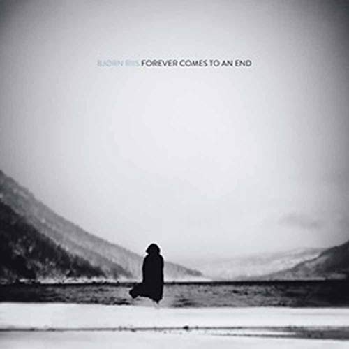 Black and white album cover featuring a lone figure in a landscape.