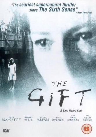 Black and white DVD cover with a woman and a large face in background.