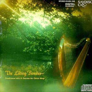 CD cover featuring a golden Celtic harp against a green, misty forest backdrop.