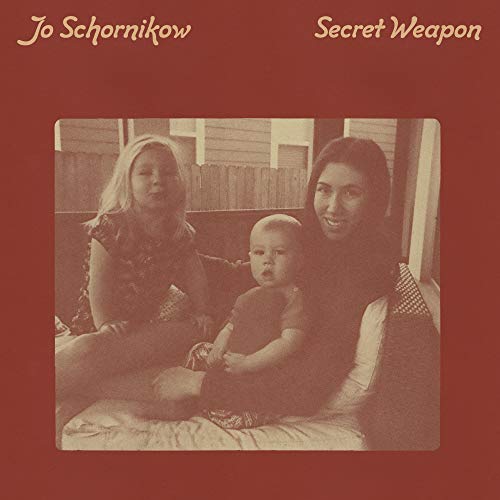 Sepia-toned album cover featuring two women and a baby seated on a couch.