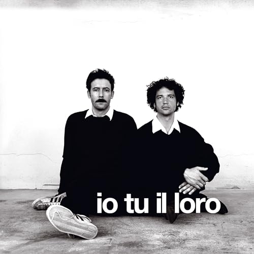 Black and white photo of two men with the album title below.