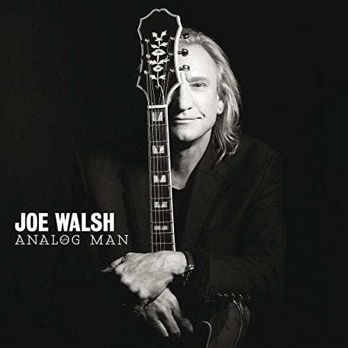 Black and white portrait of Joe Walsh with a guitar obscuring his face.