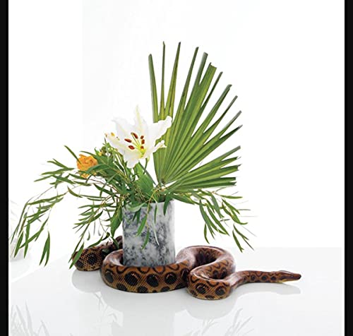 CD cover: floral arrangement in a vase with a coiled snake.
