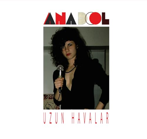 CD cover featuring a woman with curly hair holding a microphone.
