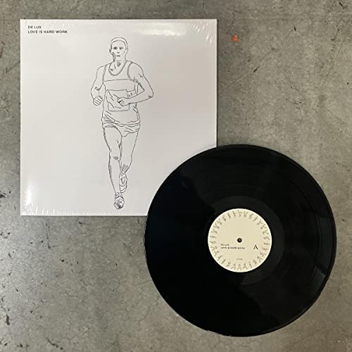 Vinyl record and album cover with a line drawing of a runner.