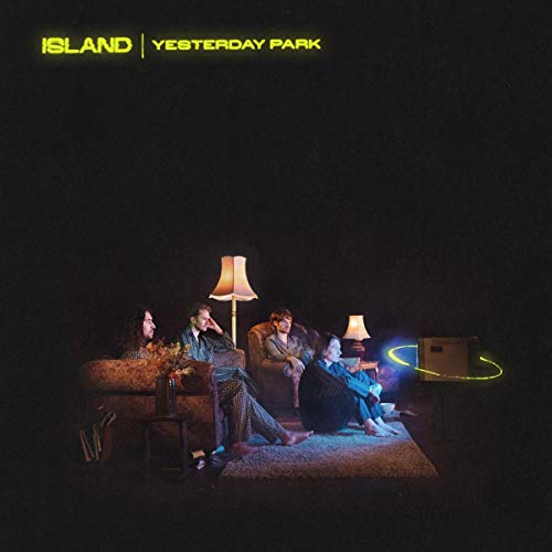 Album cover: four people seated in a dimly lit living room.