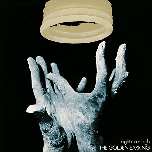 Album cover: ghostly hand reaching towards a glowing, circular shape.