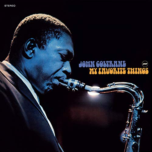 John Coltrane playing saxophone, album cover with blue and gold text.