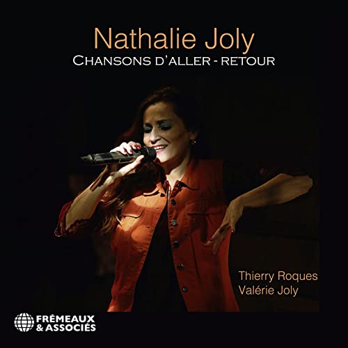 CD cover featuring singer Nathalie Joly with a microphone, dark background.