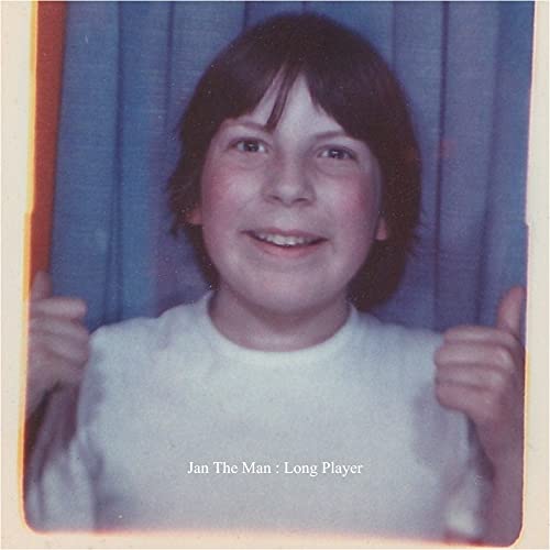 CD cover featuring a smiling young person with brown hair.