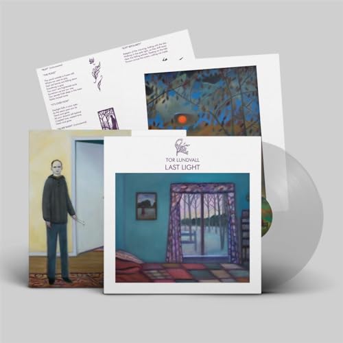 Vinyl record with album artwork featuring a man and landscape imagery.