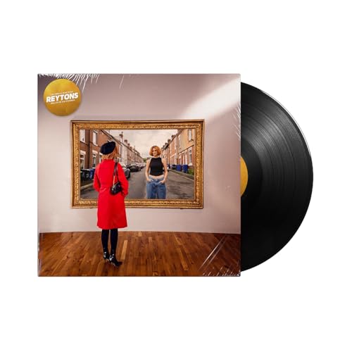 Vinyl record and album cover featuring a woman looking at her reflection.