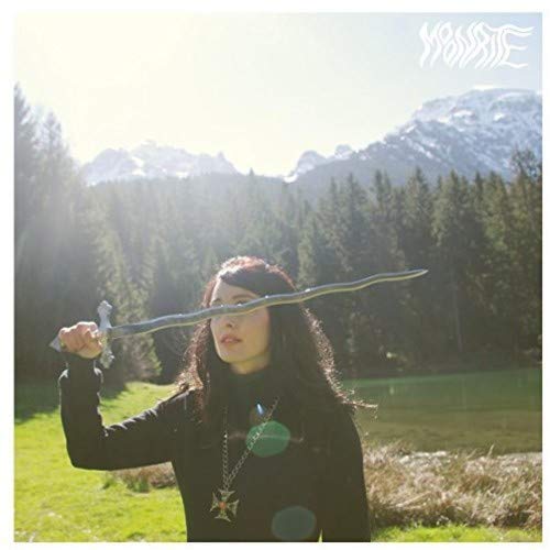 Album cover: woman holding a sword in front of mountains.