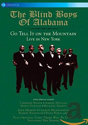 DVD cover for "Go Tell It On The Mountain" featuring a group in suits.
