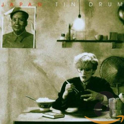 Album cover showing a person eating with chopsticks next to a portrait of Mao.