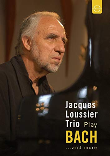 Jacques Loussier portrait with piano, DVD cover for "Jacques Loussier Trio Plays Bach".