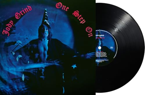 Vinyl record with cover art depicting a shadowy figure in a hat.