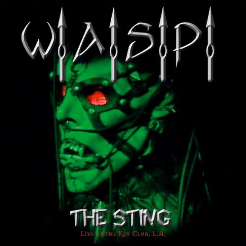W.A.S.P. album cover: green-skinned face with red eyes and metal hardware.
