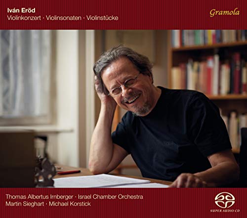 CD cover featuring smiling man with gray hair at a desk.
