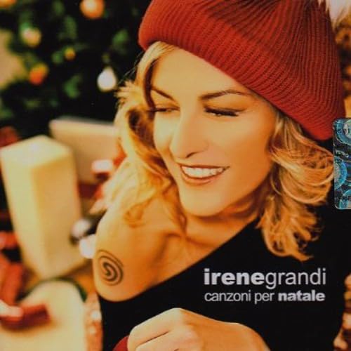 Irene Grandi album cover with artist in a red knit hat, gifts blurred.