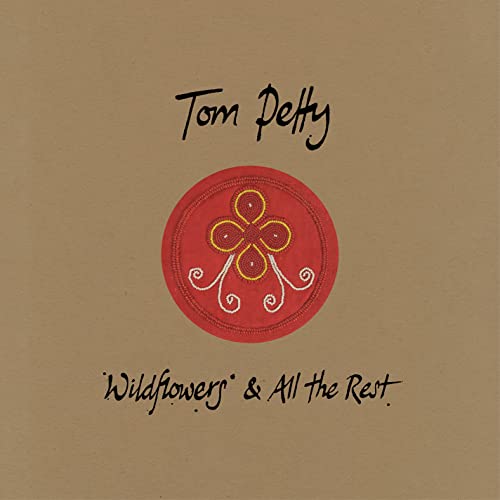 Tom Petty “Wildflowers & All The Rest” album cover with floral emblem.