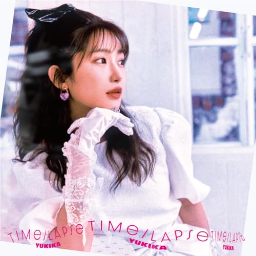 YUKIKA album cover featuring a woman in white lace near a window.