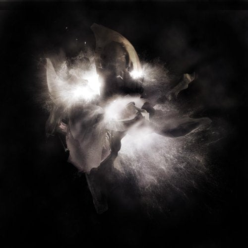 Abstract image of a figure engulfed in bright, fragmented light and shadow.