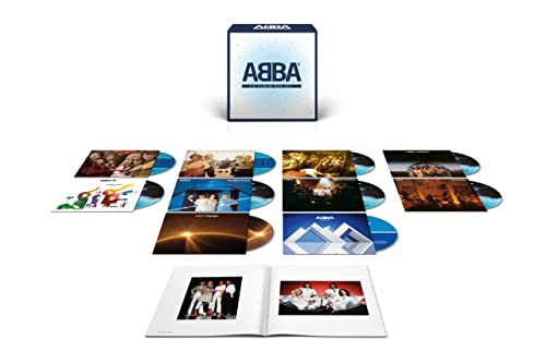 ABBA studio albums box set containing multiple CDs, album covers, and a photo book.