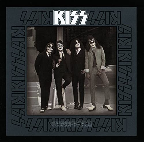Black and white album cover of Kiss band members in suits.
