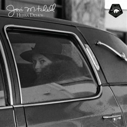 Joni Mitchell’s “Hejira Demos” vinyl record cover featuring a woman in a car.
