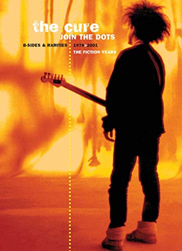 Silhouette of a musician holding a guitar against a bright orange, abstract background.