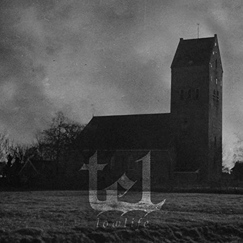 Black and white photo of a church with overlaid text "tEL" and "lowlife".