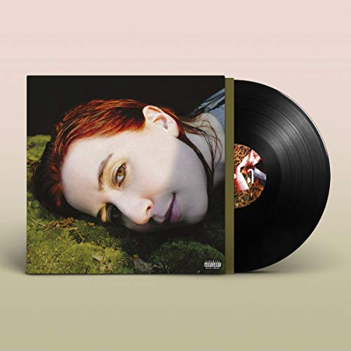 Vinyl record with album cover featuring a woman with red hair.
