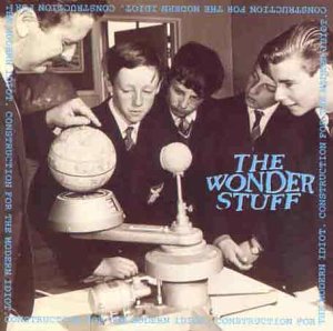 Black and white cover of “Wonder Stuff” CD with boys and a globe.