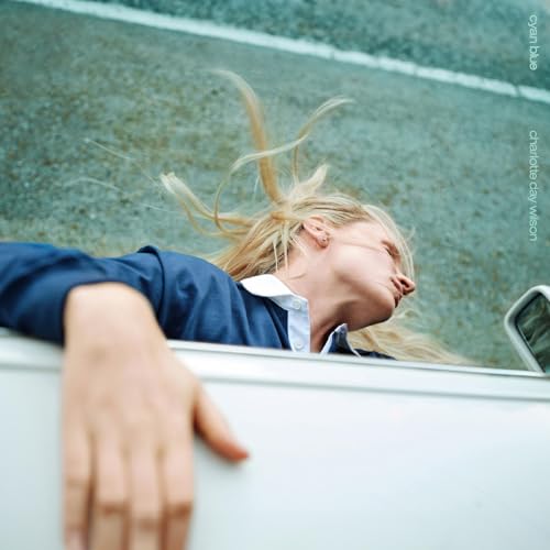 CD cover: woman with flowing blonde hair leaning out of a car.