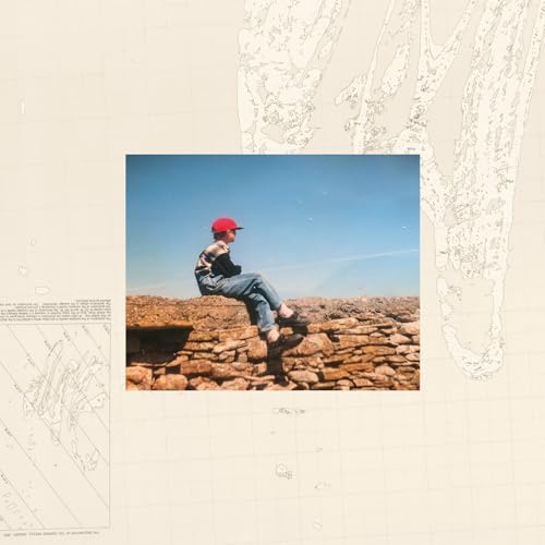 Vinyl album cover: man in red cap sitting on a stone wall.