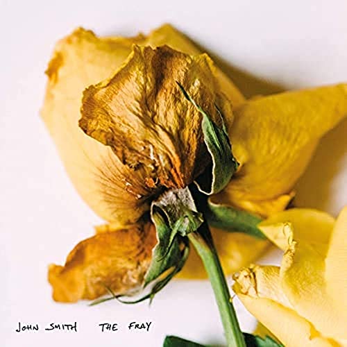 Close-up of a wilting yellow flower with album title text overlay.