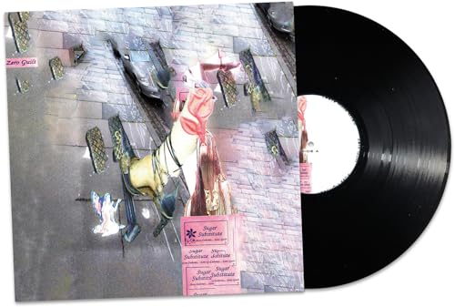 Vinyl record with cover art depicting a miniature, surreal landscape.