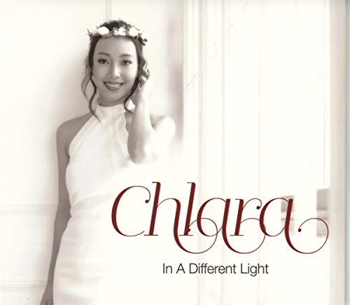 Black and white CD cover featuring a woman with a floral crown.