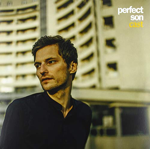 Vinyl record cover featuring a portrait of a man against a building.