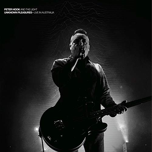 Black and white album cover featuring Peter Hook performing with a bass guitar.