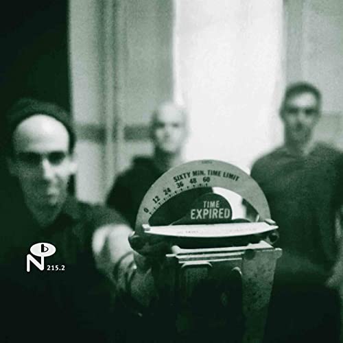 Black and white album cover featuring a person holding a timer reading "Time Expired".