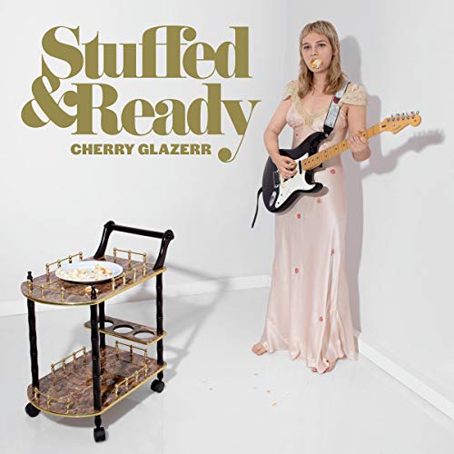 Woman with guitar, serving cart, and album title "Stuffed & Ready".
