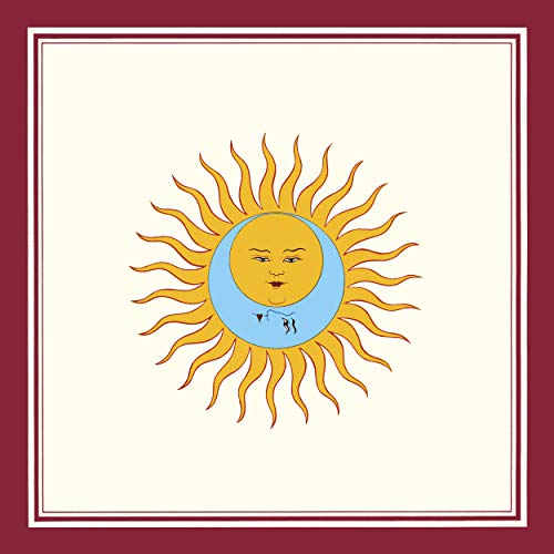 Vinyl cover art featuring a stylized sun and moon face on a cream background.
