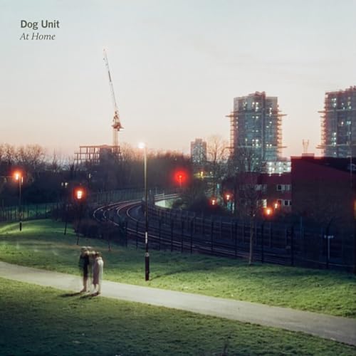 Album cover: cityscape with people walking along a path.