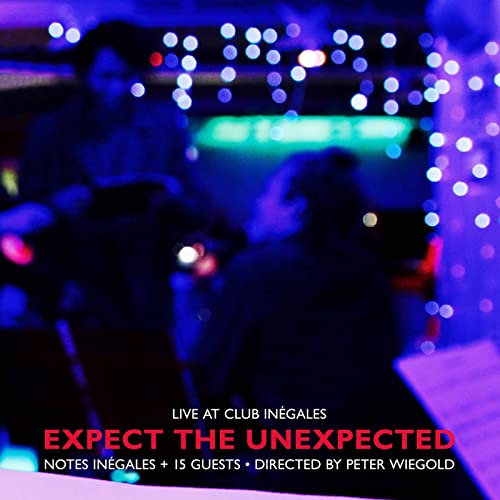 CD cover: blurred figures with bright bokeh lights, dark blue background.