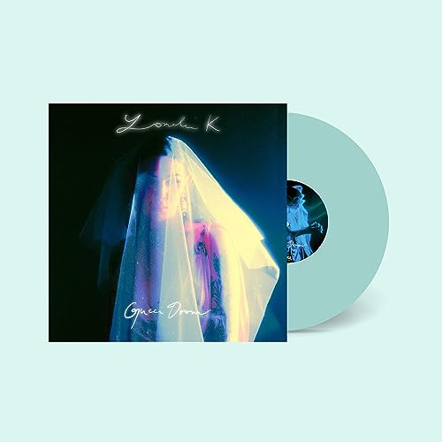 Vinyl record and cover art featuring a veiled figure in blue tones.
