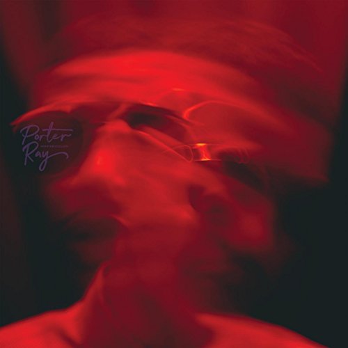A blurry, red-tinted portrait of a man wearing glasses with the text Porter Ray.
