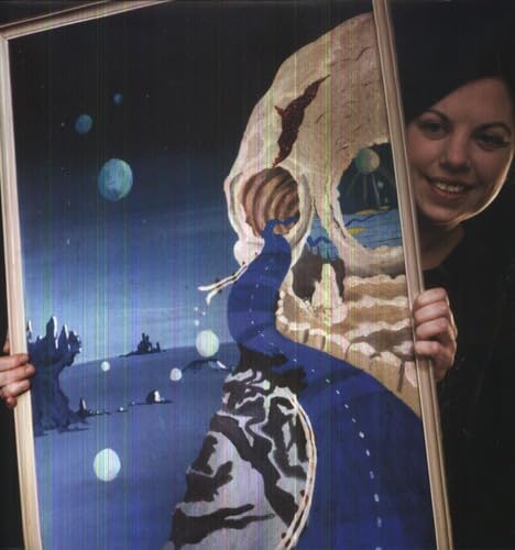 Vinyl record cover with a large skull and planetary landscape.